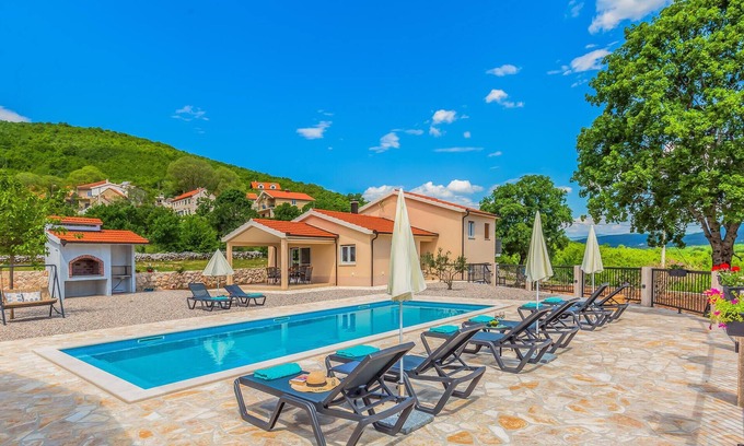 Lovrec House | Enjoy a relaxing time in this comfortable vacation home with pool.