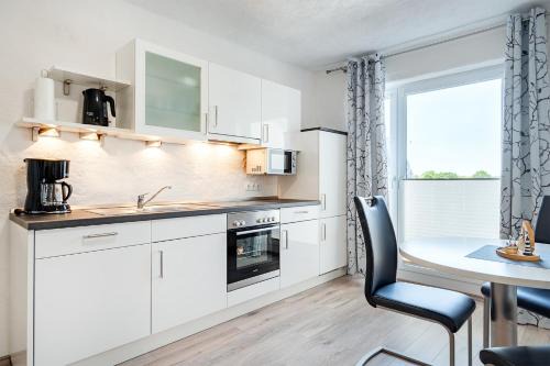 Tannenhausen Apartment | Ferienwohnung Flut mit Loggia und schönem Ausblick am Badesee Tannenhausen