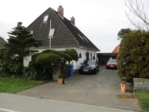 Stinteck Apartment | Haus mit Lilie und Rose