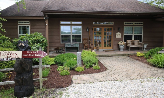 Lanesborough House | Hearts Desire is a furnished whole house in a small, colorful garden center.