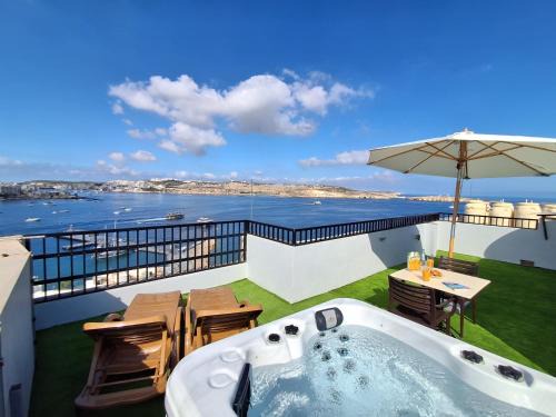 Bugibba Apartment | Islet Promenade Studio with Hot Tub and Panoramic Sea Views by GetawaysMalta