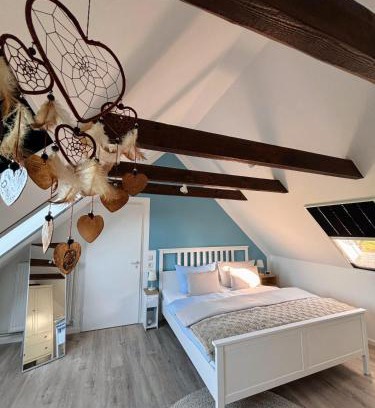 Norden House | Lüttje Koje - Ferienhaus direkt am Deich und dem Meer dahinter