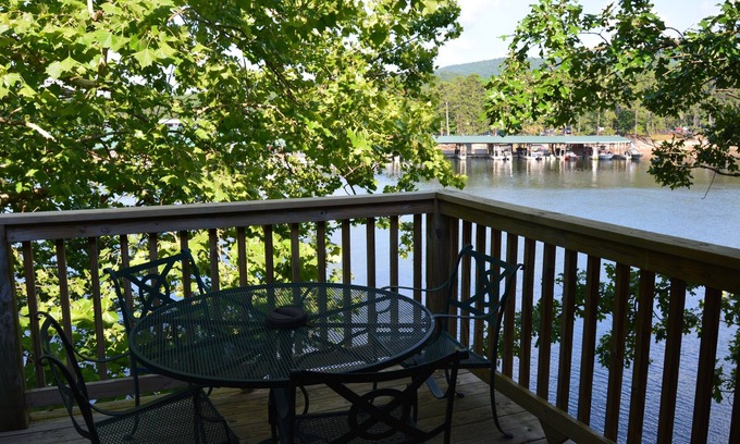 Mount Ida Cottage | Lake view two bedroom, two bath log-sided, luxury Harbor North loft cottage with hot tub overlooking Lake Ouachita. by RedAwning