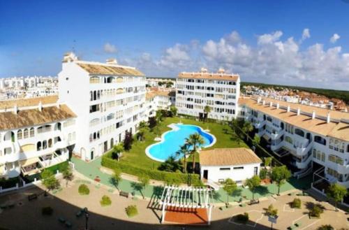 El Portil Apartment | Modern apartment with pool in the heart of El Portil