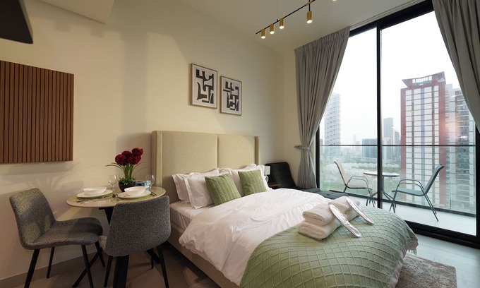 Jumeirah Village Circle Apartment | Modern Studio with Balcony Views of FIVE Hotels