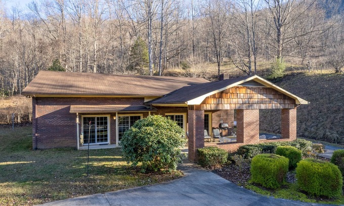 Sylva House | Mountainside house with long range views, pool table, firepit, & W/D