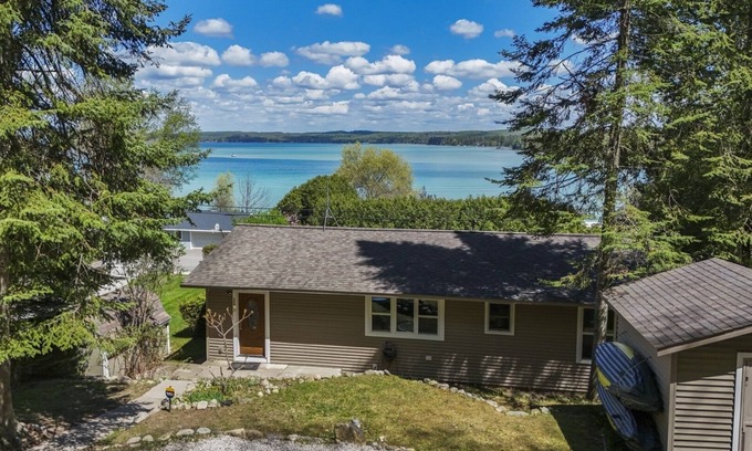 Rapid City House | NEW! Beautiful Torch Lake House with Beach Access