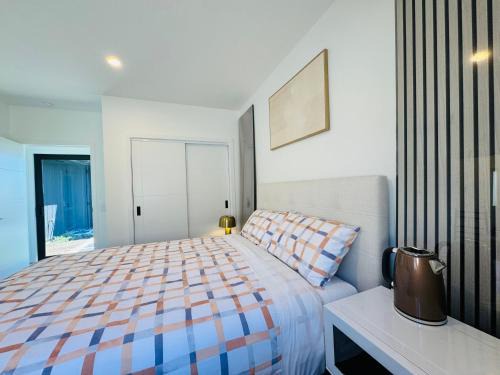 Wharewaka House | New house has bedroom with attached bathroom
