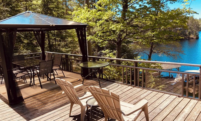 Tudor and Cashel Cabin | Private Lakefront 3 Bedroom Cabin with Private Dock and Boat Port. Boat Access
