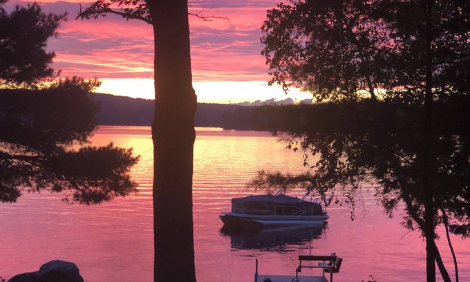 Oxford Cottage | Relax in the glow of a campfire at this waterfront cottage on Thompson Lake