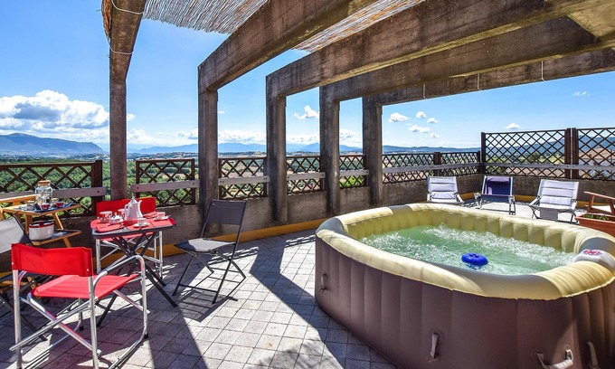 Avigliano Umbrio Apartment | Relax in the whirlpool with panoramic views of the Umbrian countryside.