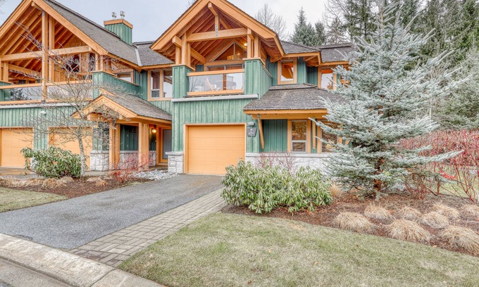 Village North House | Relaxing first-floor townhouse with a private hot tub, fireplace, & great views