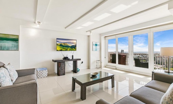 South Padre Island House | Rise & shine in paradise! Stylish Bayview condo beachfront resort shared pools &jacuzzi