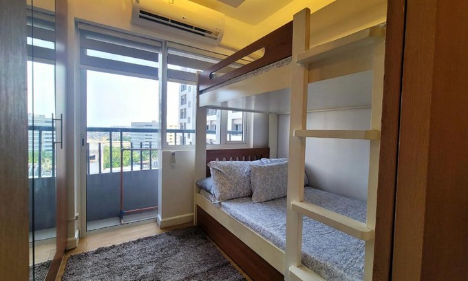 Ususan Apartment | Spacious condo with pool view at Grace Residences, near BGC