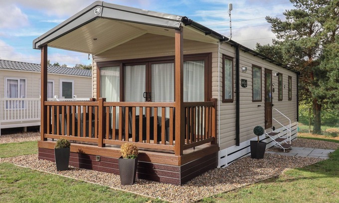 Hopton Cottage | STAG LODGE, CARAVAN 70, with pool in Belton, Norfolk