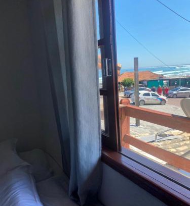 Praia Grande Hotel | Suites e Quartos Em frente a Praia Grande -Na orla Flavia Alessandra