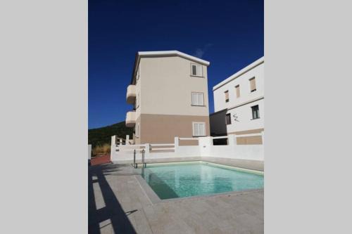 Badesi Apartment | Trilocale vista mare con piscina a Badesi