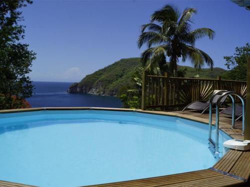 Deshaies Villa | Villa Palma avec vue mer et piscine privée location Domaine de la Pointe Batterie à Deshaies