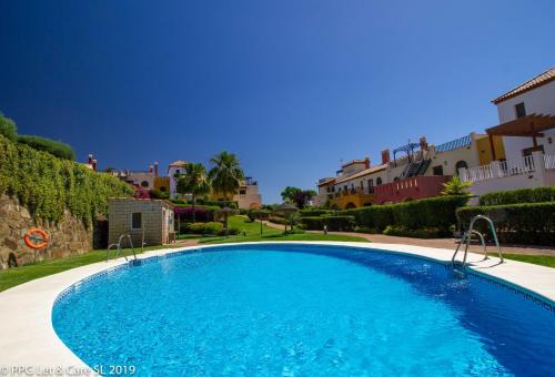 Costa Esuri House | (WAR002) Town House with Garden and Pool Access