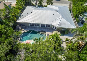 Breezy canalfront home w/ heated pool & dock - 3 blocks to Bean Point Beach
