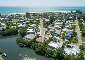 Breezy canalfront home w/ heated pool & dock - 3 blocks to Bean Point Beach