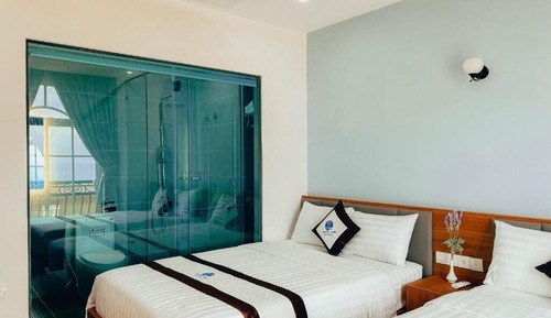 Deluxe Quadruple Room, Balcony, Beach View