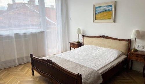 One-Bedroom Apartment with Balcony and City View