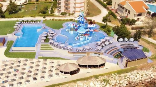 Double Room with Balcony and Side Sea View (2 Adults + 1 Child ) - Building 2 - Free Beach Access