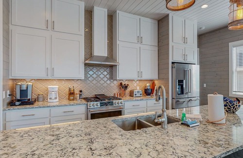 Port Aransas House | KD671 Luxurious Home with Private Heated Pool and Oasis, Partial Gulf Views and Golf Cart Included!