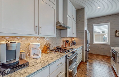 Port Aransas House | KD671 Luxurious Home with Private Heated Pool and Oasis, Partial Gulf Views and Golf Cart Included!