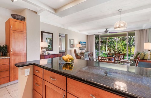 Kaanapali Condo | Maui Resort Rentals: The Whaler 124 - Luxurious Ground Floor Corner 1BR/2BA w/ Wrap-Around Balcony, Partial Ocean and West Maui Mountain Views, Large Adjacent Lawn Area