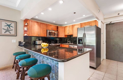 Kaanapali Condo | Maui Resort Rentals: The Whaler 124 - Luxurious Ground Floor Corner 1BR/2BA w/ Wrap-Around Balcony, Partial Ocean and West Maui Mountain Views, Large Adjacent Lawn Area