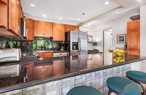 Kaanapali Condo | Maui Resort Rentals: The Whaler 124 - Luxurious Ground Floor Corner 1BR/2BA w/ Wrap-Around Balcony, Partial Ocean and West Maui Mountain Views, Large Adjacent Lawn Area