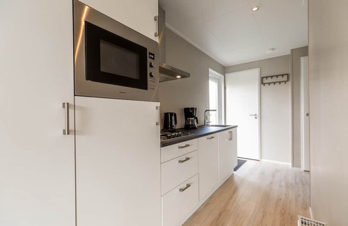 Lathum Ski Chalet | Chalet With Pond View in Gelderland