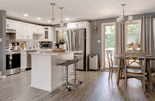 Columbus House | Newly remodeled home, spacious deck w/ string lights, & large yard with firepit