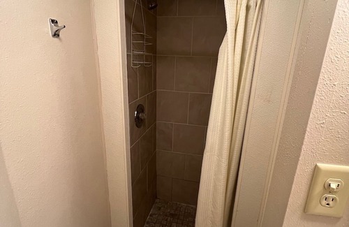 Onalaska House | Overlooking Lake Onalaska -- full-size bed + bath in nostalgic motel