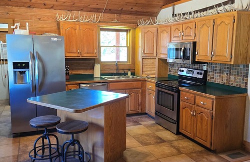 Stockton Cabin | Secluded Cabin - Hunt + Fish + Float Sac River/Stockton. Family and Pet Friendly