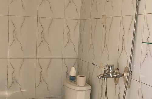 Limete House | Cozy Guest Room in Kinshasa with Balcony and Partial Air-Conditioning