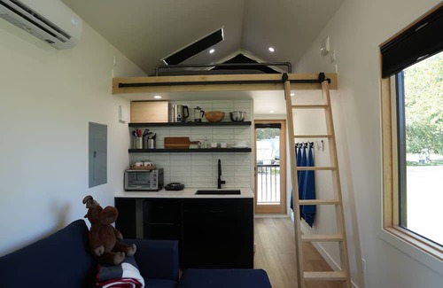 Rocky Mountain House Cabin | River South HardTop: modern decked-out cabin with a river view