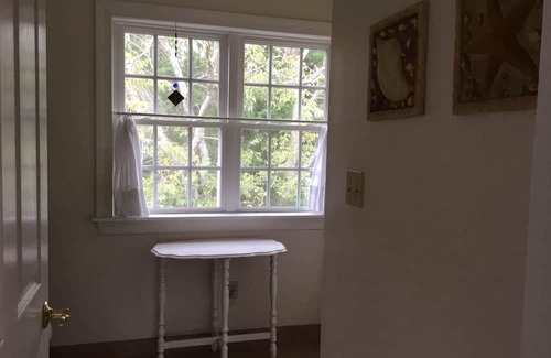 Cape May Point House | Pristine, Cozy, 4 bedroom Beach Cottage with a 40 foot screened in front porch!