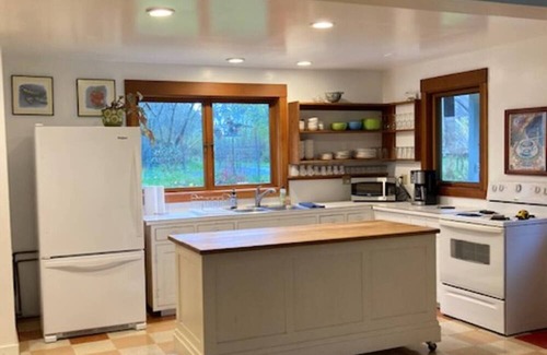 Eastsound House | Dragonfly Pond house is a rustic, spacious, light-filled vacation rental home on Orcas Island with high ceilings overlooking a tranquil pond. Clean & comfy. Located in 7 acres of forest, it's peaceful and secluded. Close to town and the ferry.