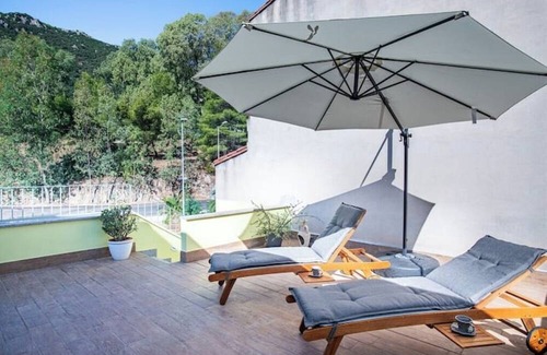 Guspini House | Cozy atmosphere in the room with private bathroom