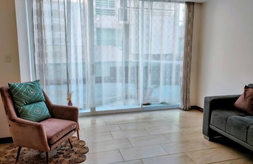 Conocoto Apartment | Minimalist suite with volcano view