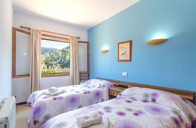 ES VINT I NOU - Beautiful house with great terrace amidst the mountains.