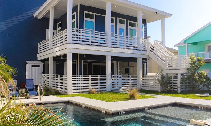 Port Aransas House | KD671 Luxurious Home with Private Heated Pool and Oasis, Partial Gulf Views and Golf Cart Included!