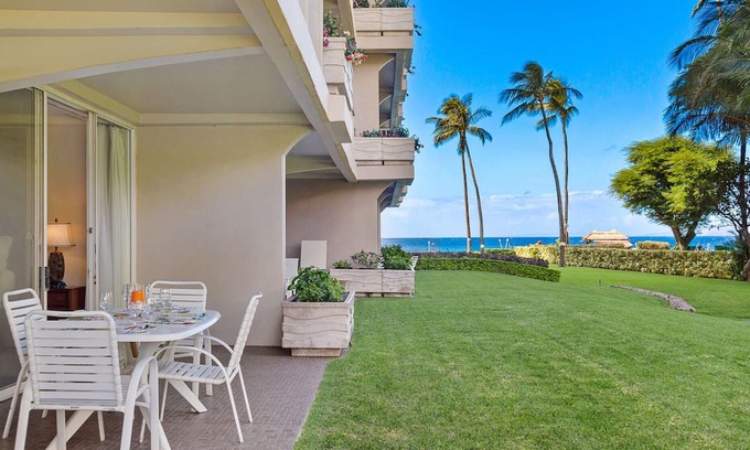 Kaanapali Condo | Maui Resort Rentals: The Whaler 124 - Luxurious Ground Floor Corner 1BR/2BA w/ Wrap-Around Balcony, Partial Ocean and West Maui Mountain Views, Large Adjacent Lawn Area