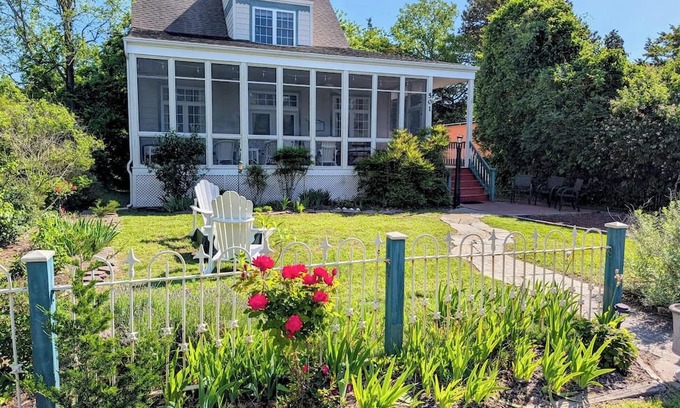 Cape May Point House | Pristine, Cozy, 4 bedroom Beach Cottage with a 40 foot screened in front porch!