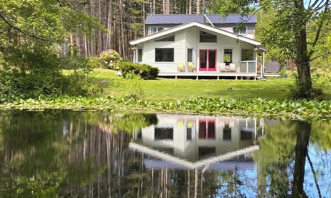 Eastsound House | Dragonfly Pond house is a rustic, spacious, light-filled vacation rental home on Orcas Island with high ceilings overlooking a tranquil pond. Clean & comfy. Located in 7 acres of forest, it's peaceful and secluded. Close to town and the ferry.